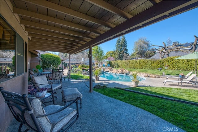 view of patio / terrace with a fenced in pool and a fenced backyard