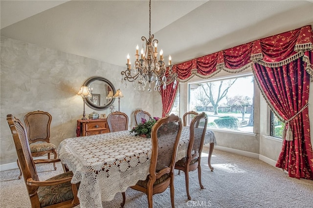 carpeted dining space with lofted ceiling, baseboards, and a chandelier