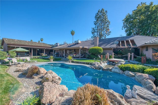 outdoor pool featuring a patio