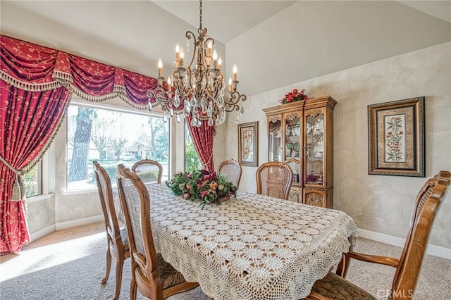 dining room with an inviting chandelier, lofted ceiling, baseboards, and light carpet