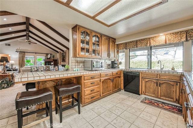 kitchen featuring a peninsula, vaulted ceiling with beams, glass insert cabinets, dishwasher, and open floor plan