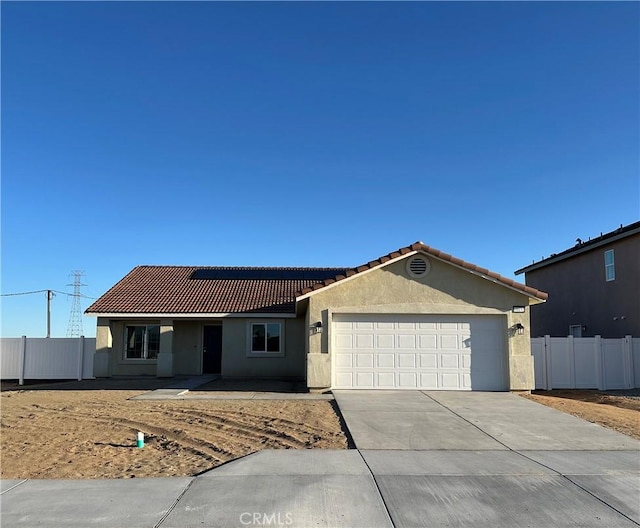 ranch-style house with stucco siding, driveway, a tile roof, and fence