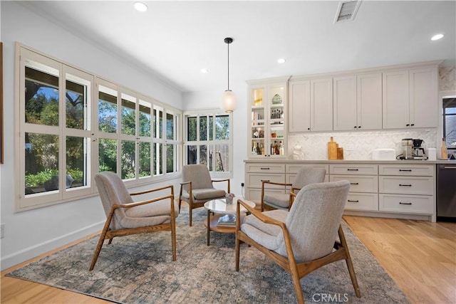 interior space featuring recessed lighting, visible vents, baseboards, and light wood finished floors