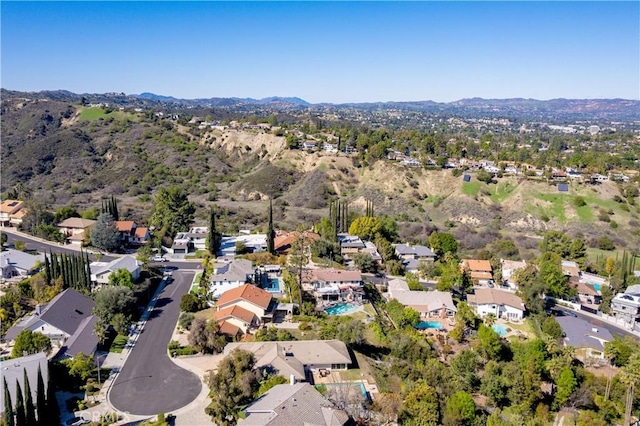 drone / aerial view featuring a mountain view and a residential view