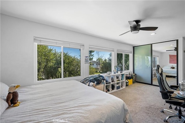 carpeted bedroom featuring a ceiling fan