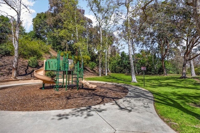 communal playground featuring a yard