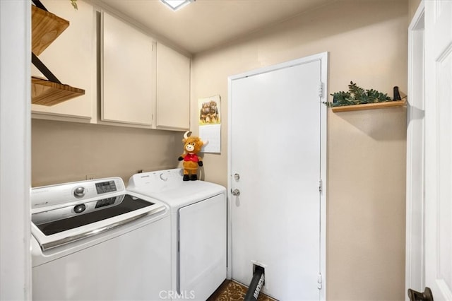 laundry area with cabinet space and independent washer and dryer