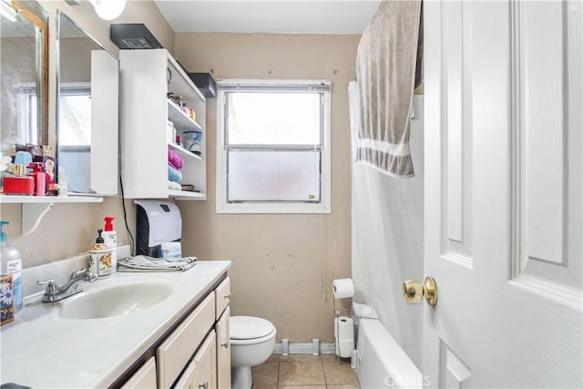 bathroom with baseboards, toilet, shower / bath combo, tile patterned floors, and vanity