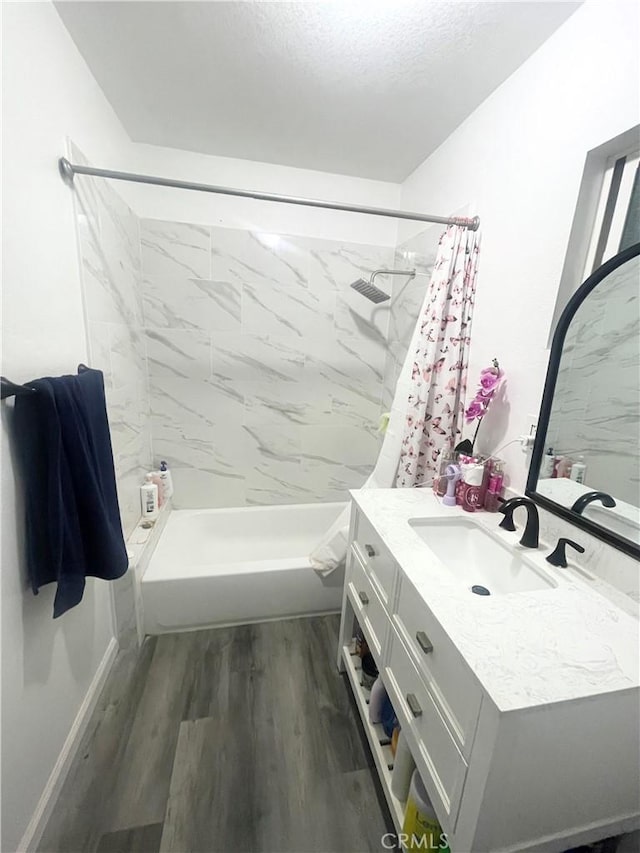 full bathroom featuring wood finished floors and vanity