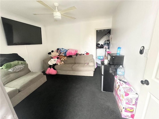 carpeted living area featuring ceiling fan