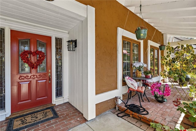 doorway to property featuring a porch