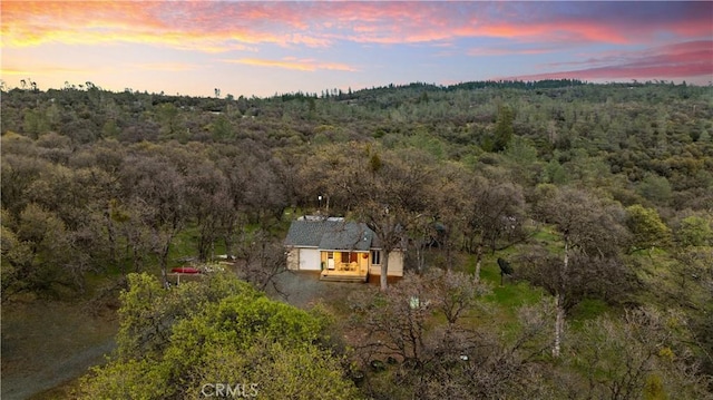 drone / aerial view with a view of trees