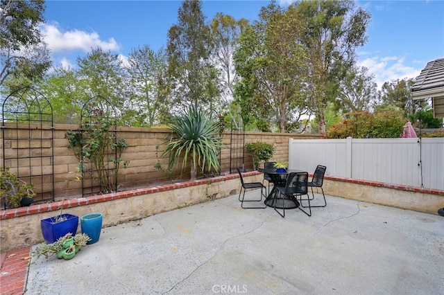 view of patio / terrace with outdoor dining area and a fenced backyard