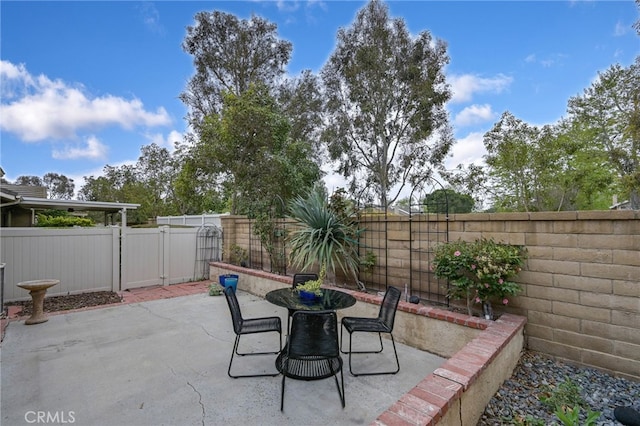 view of patio / terrace featuring outdoor dining space and a fenced backyard