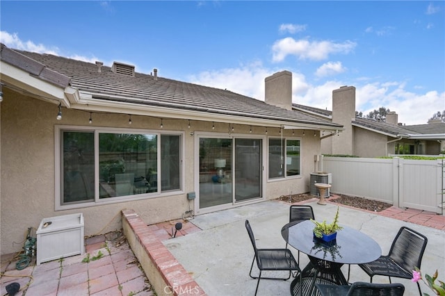 view of patio / terrace featuring fence