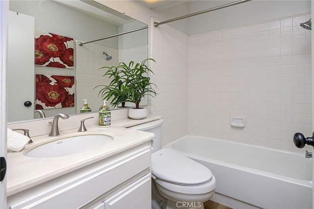 bathroom featuring vanity, toilet, and shower / bathtub combination