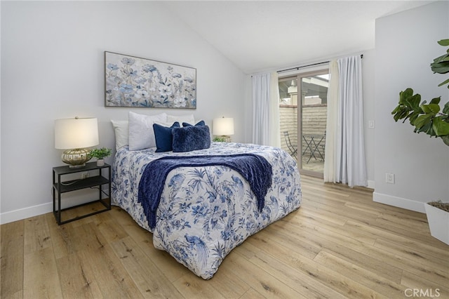 bedroom with light wood-style flooring, lofted ceiling, baseboards, and access to exterior