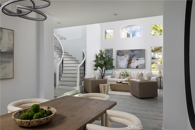 living area featuring stairs and wood finished floors