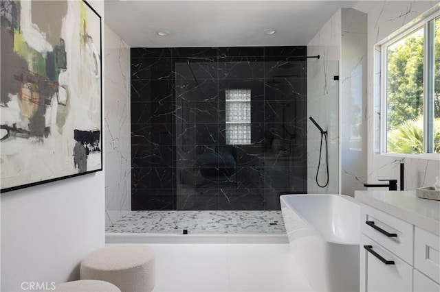 bathroom featuring vanity, a freestanding tub, recessed lighting, and a marble finish shower