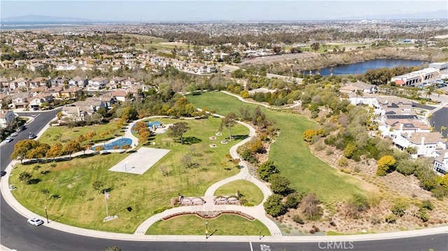 drone / aerial view with a residential view and a water view