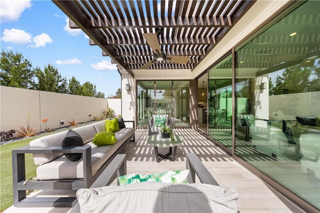 view of patio featuring an outdoor hangout area, a pergola, a fenced backyard, and a ceiling fan