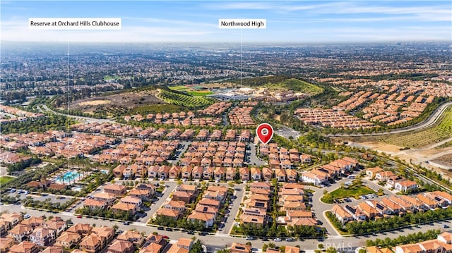 birds eye view of property with a residential view