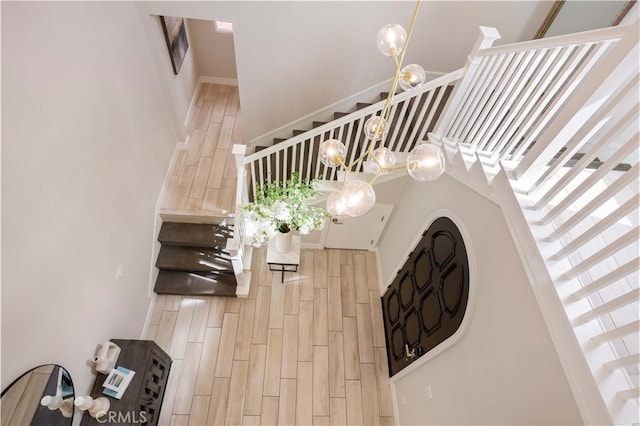 stairway featuring wood tiled floor