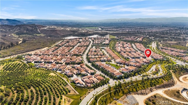 birds eye view of property with a mountain view