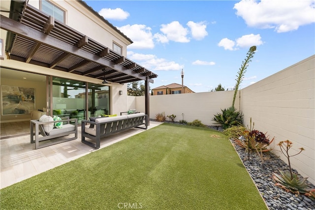 view of yard with a patio, outdoor lounge area, a fenced backyard, and a pergola