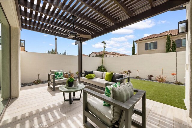 view of patio / terrace featuring a fenced backyard, a pergola, and an outdoor hangout area