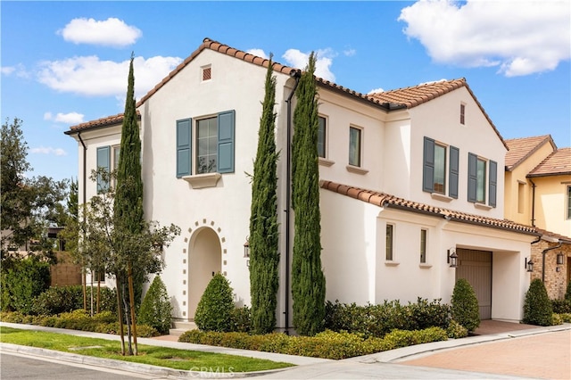 mediterranean / spanish house with stucco siding