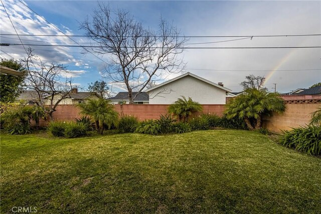 view of yard featuring fence