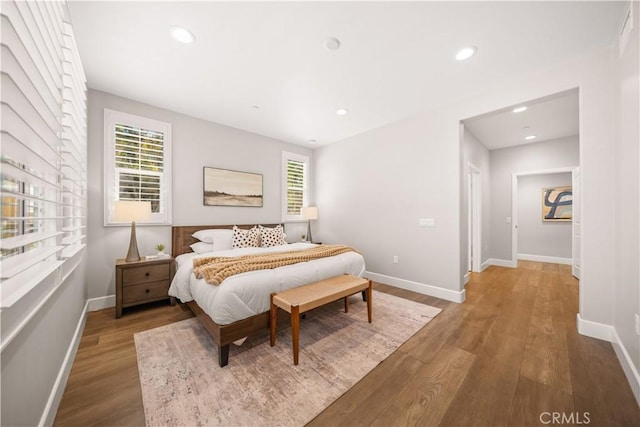 bedroom featuring recessed lighting, baseboards, and wood finished floors