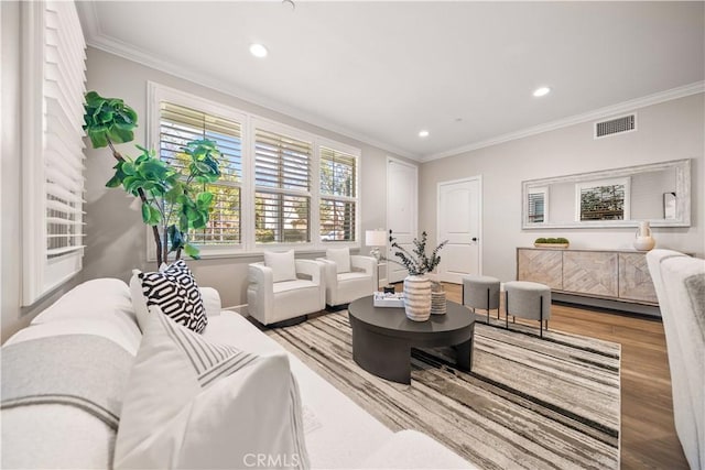 living room featuring recessed lighting, visible vents, wood finished floors, and crown molding