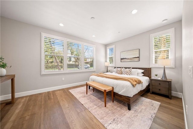 bedroom featuring recessed lighting, baseboards, and wood finished floors