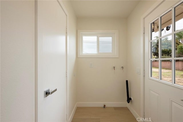 laundry room featuring laundry area and baseboards