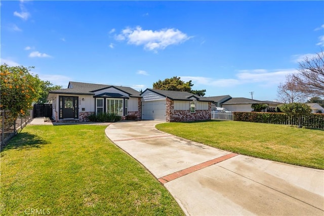 ranch-style home featuring a front yard, fence, driveway, an attached garage, and board and batten siding