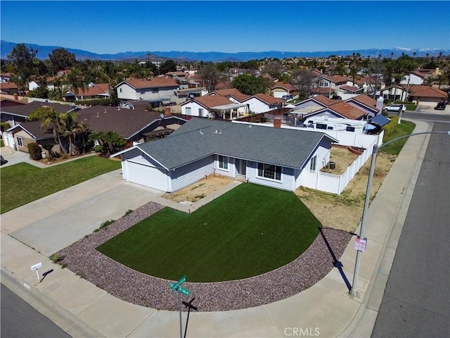 drone / aerial view with a mountain view and a residential view