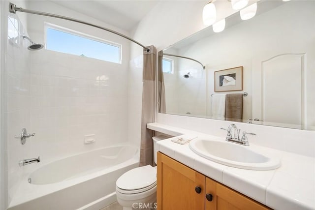 bathroom featuring vanity, shower / bath combination with curtain, and toilet