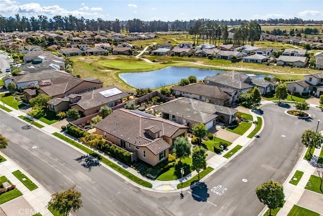 drone / aerial view featuring a residential view and a water view