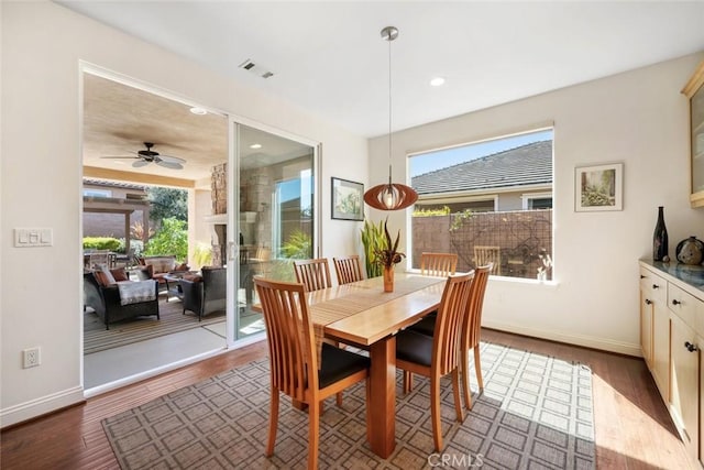 dining space featuring visible vents, ceiling fan, baseboards, recessed lighting, and dark wood-style flooring