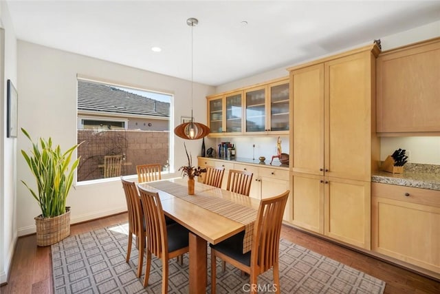 dining area with light wood finished floors, recessed lighting, and baseboards