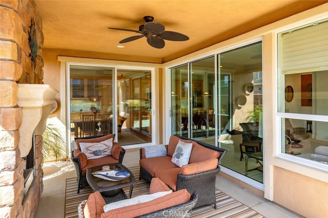 view of patio featuring an outdoor living space and a ceiling fan