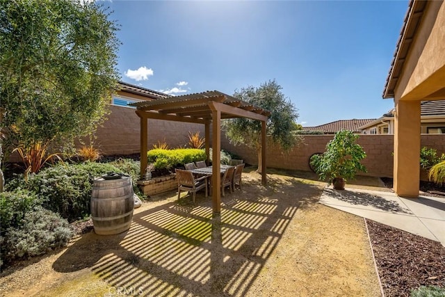 view of patio featuring fence, outdoor dining space, and a pergola