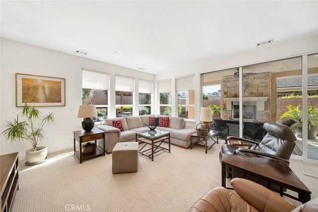 sunroom / solarium with a fireplace and visible vents