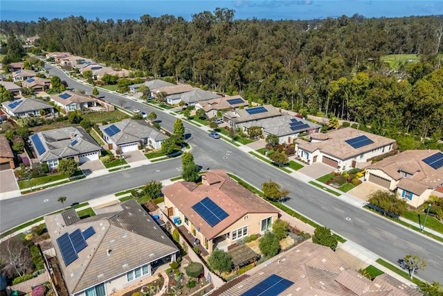 aerial view with a wooded view and a residential view