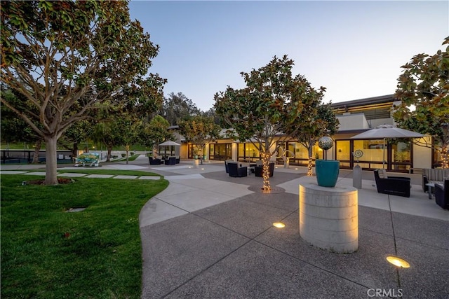 view of home's community featuring an outdoor living space, a yard, and a patio area