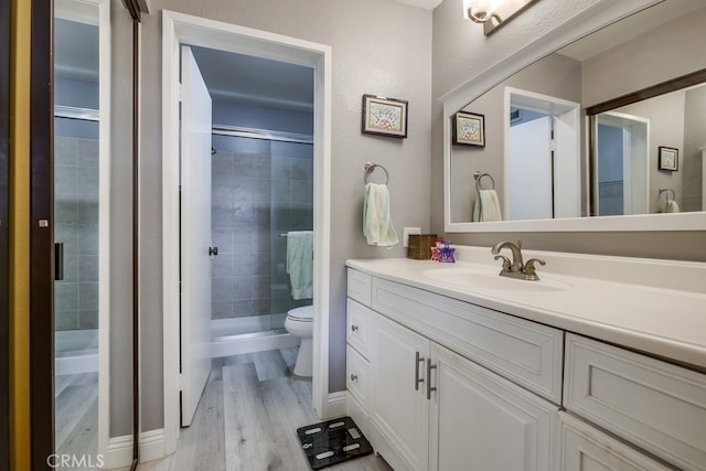 27578 Lene, Mission Viejo, CA 92692 - bathroom with a shower stall, vanity, toilet, and wood finished floors