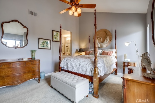 bedroom with visible vents, ensuite bathroom, baseboards, and carpet floors