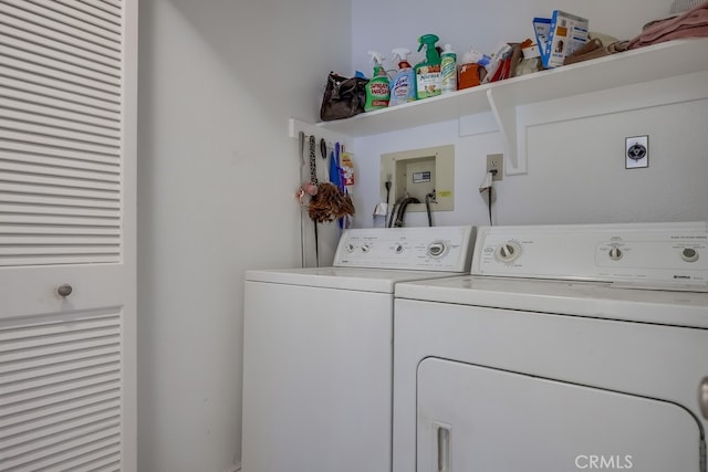 washroom featuring laundry area and washing machine and clothes dryer